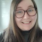 Staff members in charity vests